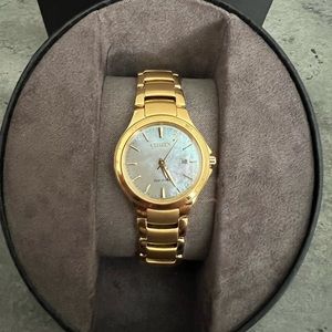 Citizen watch eco drive womens Gold Tone Stainless with a white Mother-of-Pearl.